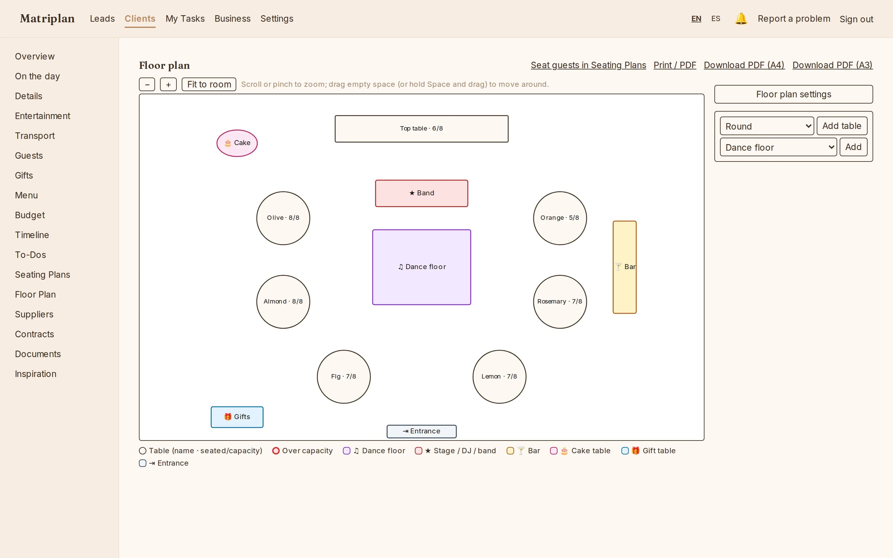The floor plan editor: top table, round tables, dance floor, band, bar and entrance, each table showing its seats filled.